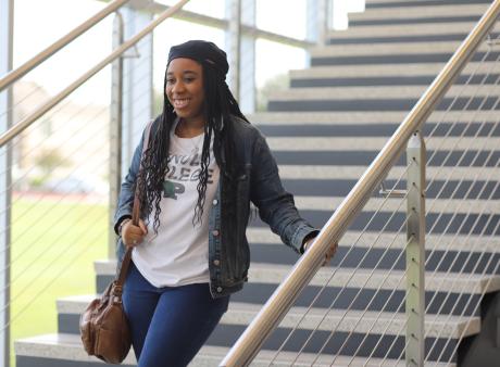 woman wlaking down stairs 